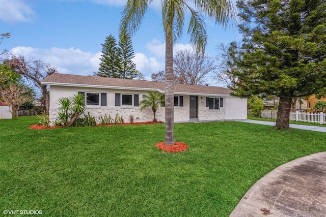 ranch-style house with a front yard