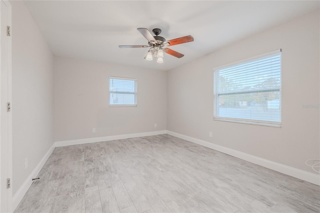 spare room featuring ceiling fan and light hardwood / wood-style floors