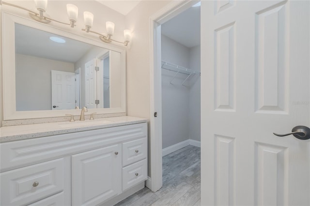 bathroom with vanity and hardwood / wood-style floors