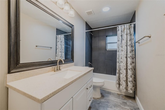 full bathroom with vanity, toilet, and shower / bath combo