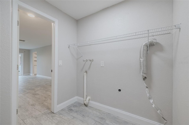 laundry area with hookup for a washing machine and hookup for an electric dryer