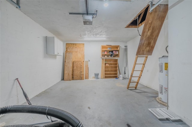 garage featuring a garage door opener and electric water heater