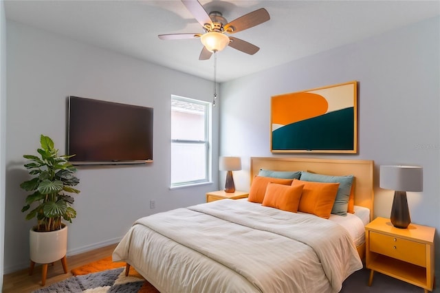 bedroom with hardwood / wood-style flooring and ceiling fan