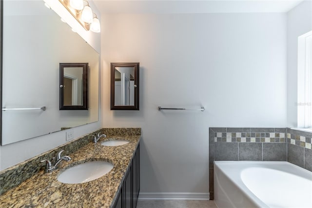 bathroom with vanity and a bathtub