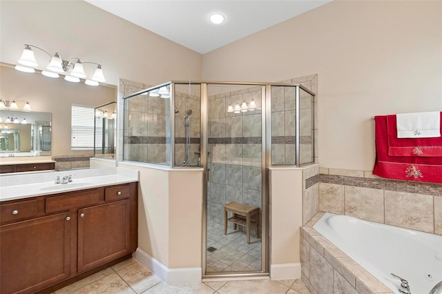 bathroom featuring tile patterned floors, vanity, and separate shower and tub