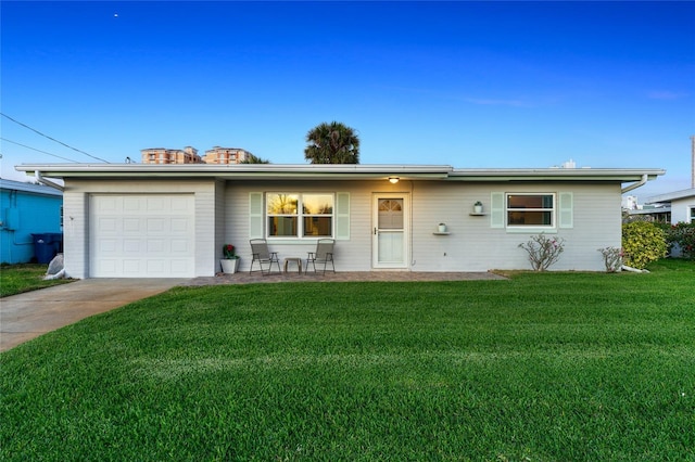 ranch-style house with a garage and a front yard