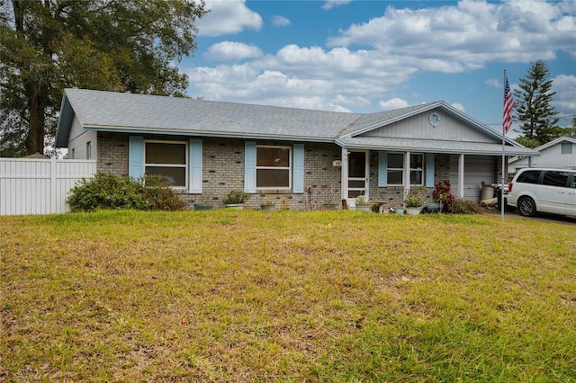 single story home featuring a front yard