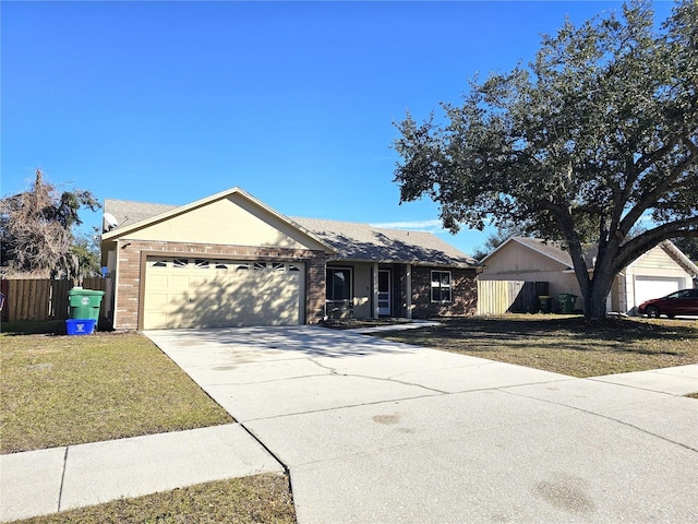 ranch-style home featuring a garage and a front yard