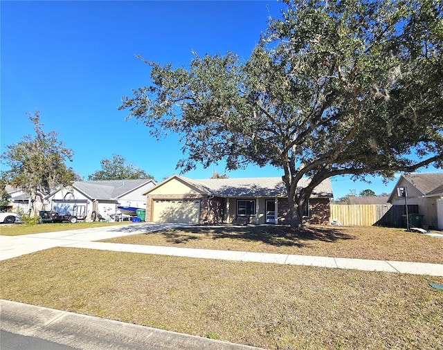 view of front of property featuring a garage and a front yard