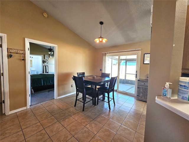 dining area featuring lofted ceiling, light tile patterned floors, and ceiling fan