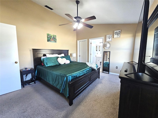 carpeted bedroom featuring vaulted ceiling, ceiling fan, and ensuite bathroom