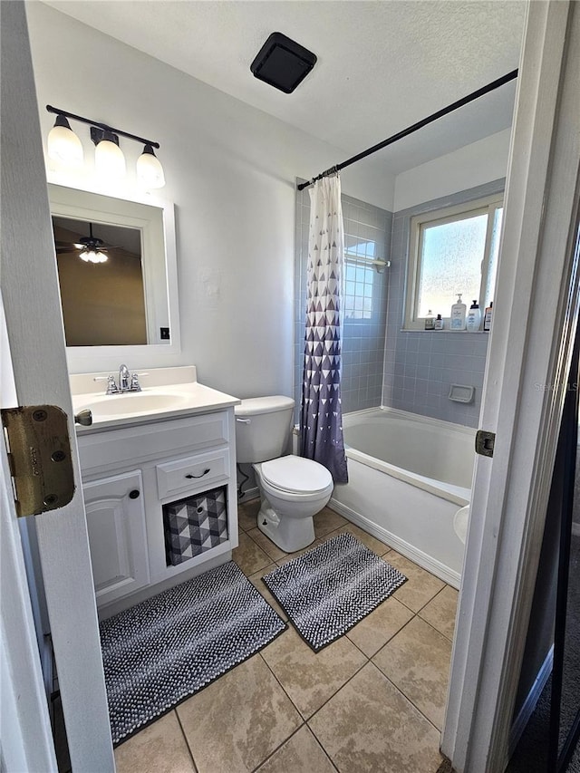 full bathroom featuring vanity, tile patterned floors, toilet, and shower / bath combo