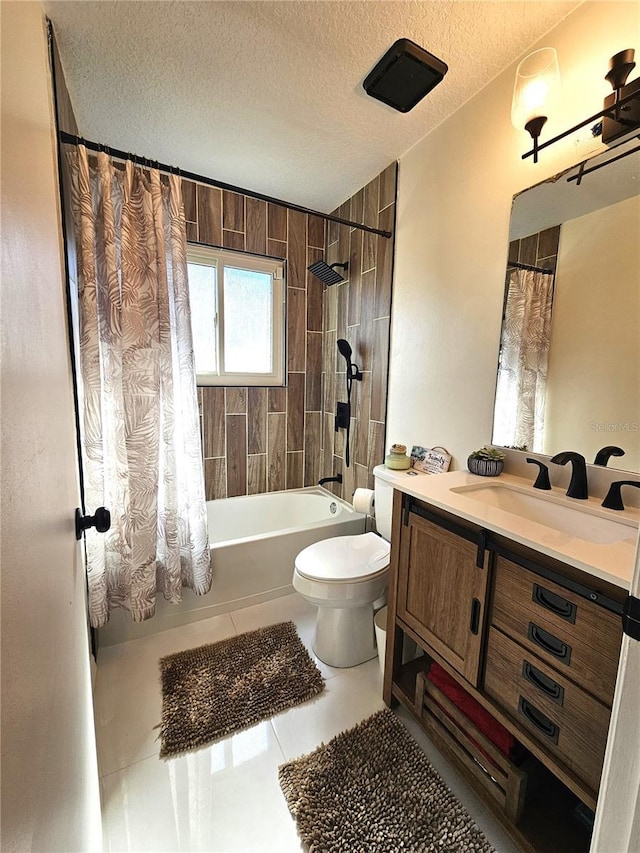 full bathroom with shower / tub combo with curtain, toilet, a textured ceiling, vanity, and tile patterned flooring