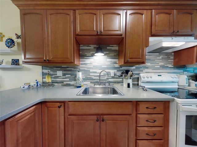 kitchen featuring sink, white electric range, and decorative backsplash