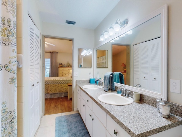 bathroom featuring tile patterned floors and vanity