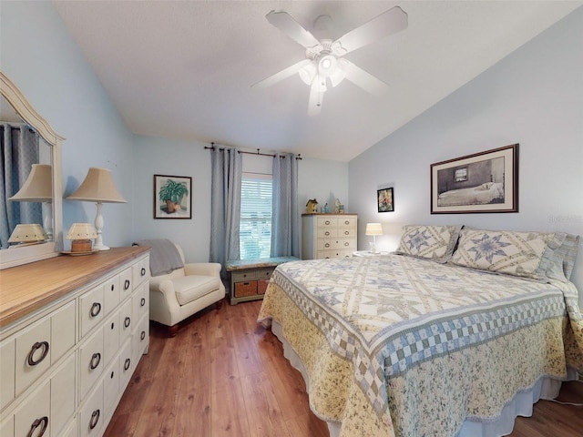 bedroom featuring lofted ceiling, dark wood-type flooring, and ceiling fan