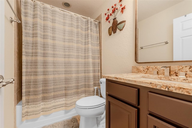 bathroom featuring shower / bath combination with curtain, vanity, and toilet