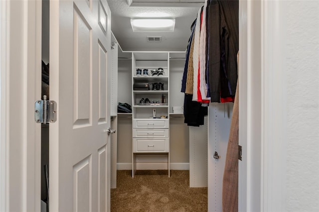 walk in closet with carpet and visible vents