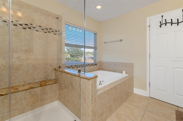 full bath featuring a garden tub, recessed lighting, tiled shower, and tile patterned floors