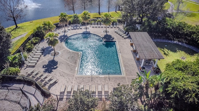 birds eye view of property with a water view