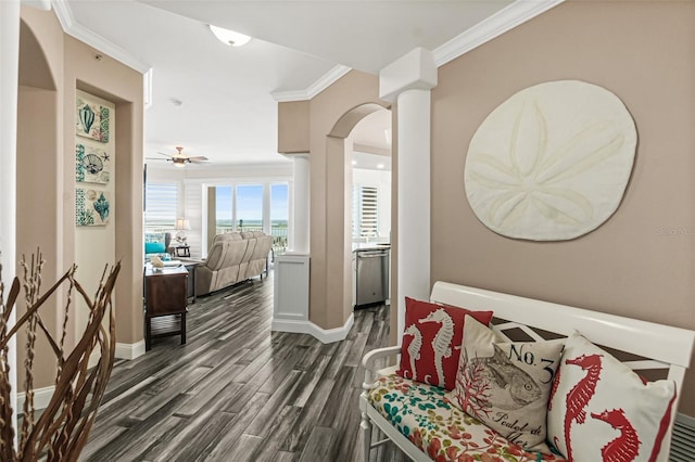 hall featuring ornate columns, crown molding, and dark hardwood / wood-style floors