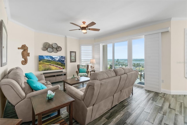 living room featuring crown molding and ceiling fan