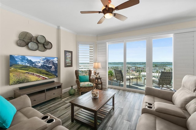 living room with crown molding, hardwood / wood-style floors, and ceiling fan