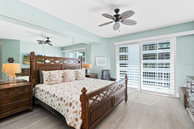 bedroom with access to exterior, ceiling fan, and light hardwood / wood-style floors