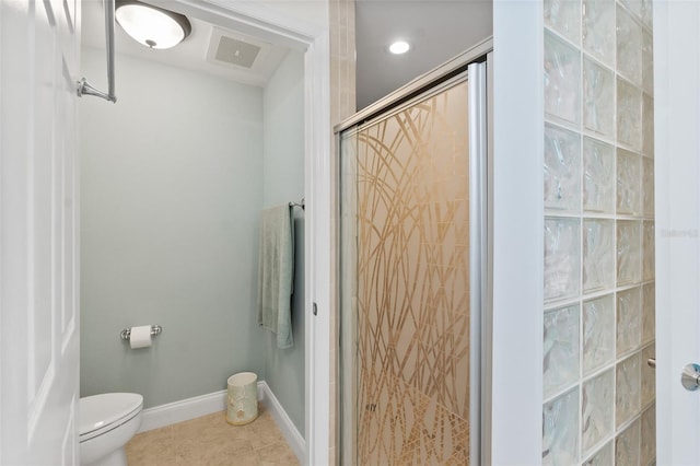 bathroom with tile patterned floors, a shower with door, and toilet