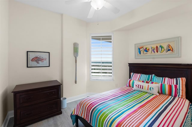 bedroom featuring ceiling fan and light hardwood / wood-style floors