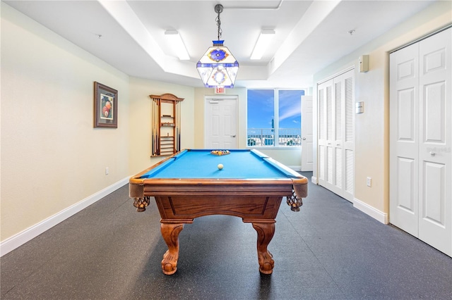 game room featuring a tray ceiling and billiards