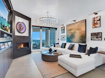 living room with a notable chandelier