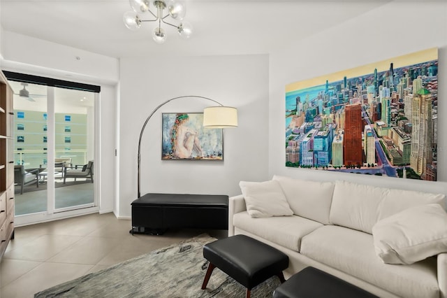 living room featuring a notable chandelier and tile patterned floors