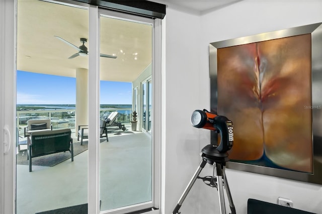 interior space with ceiling fan