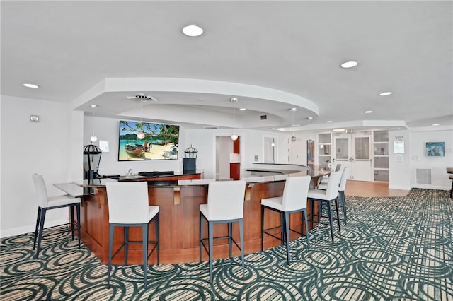 kitchen with a breakfast bar area and a center island