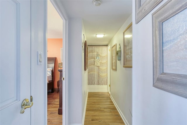 hall with light hardwood / wood-style flooring