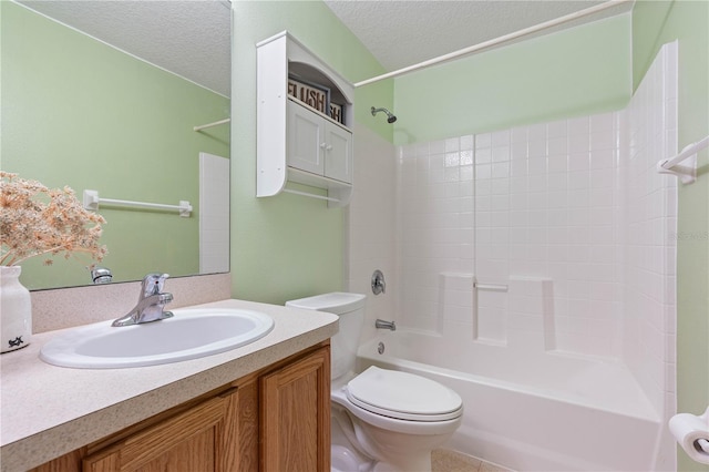 full bathroom featuring vanity, shower / bathing tub combination, a textured ceiling, and toilet