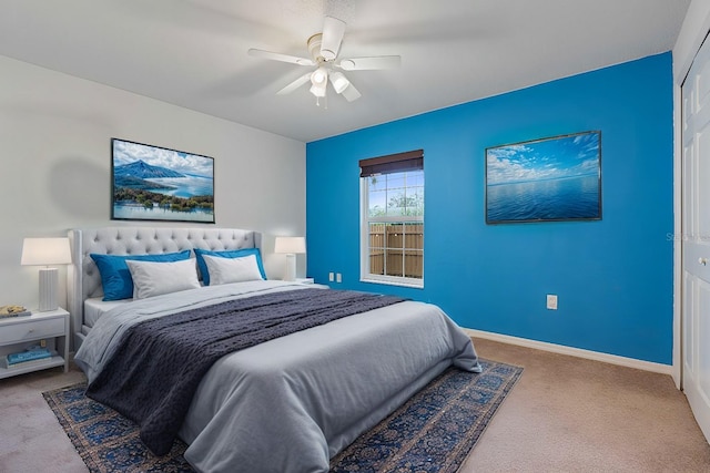 bedroom with light colored carpet, a closet, and ceiling fan