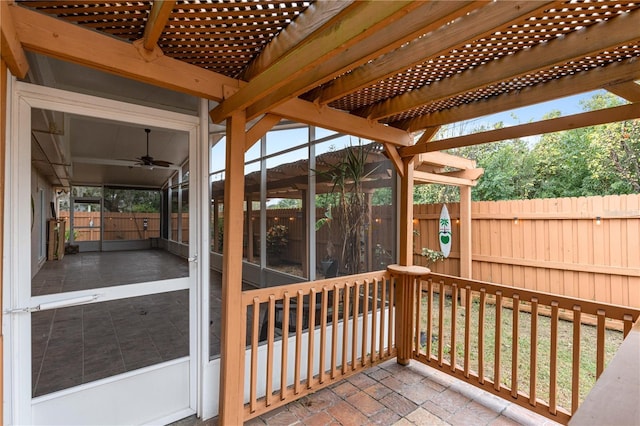 deck featuring ceiling fan and a patio