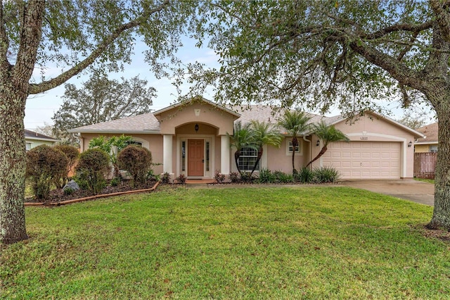 ranch-style home with a garage and a front lawn