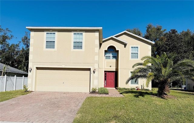 view of front facade with a garage and a front lawn