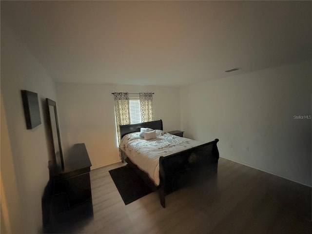 bedroom with light wood-type flooring