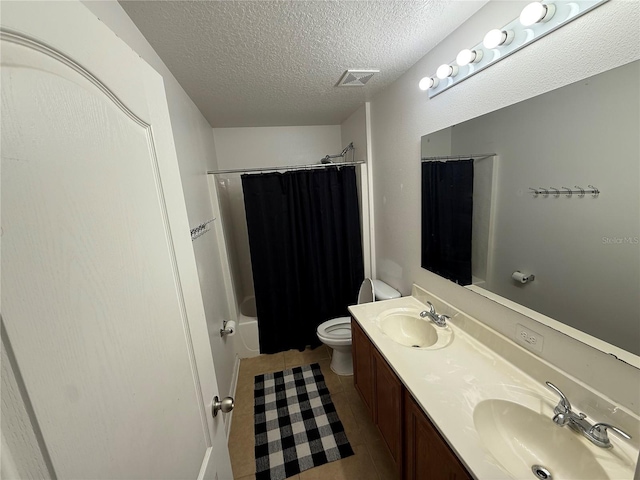 full bathroom featuring shower / tub combo with curtain, toilet, a textured ceiling, vanity, and tile patterned flooring