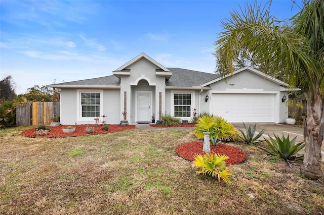 ranch-style home with a garage and a front lawn