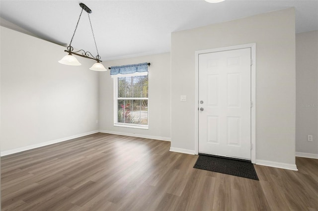 entryway with dark wood-type flooring