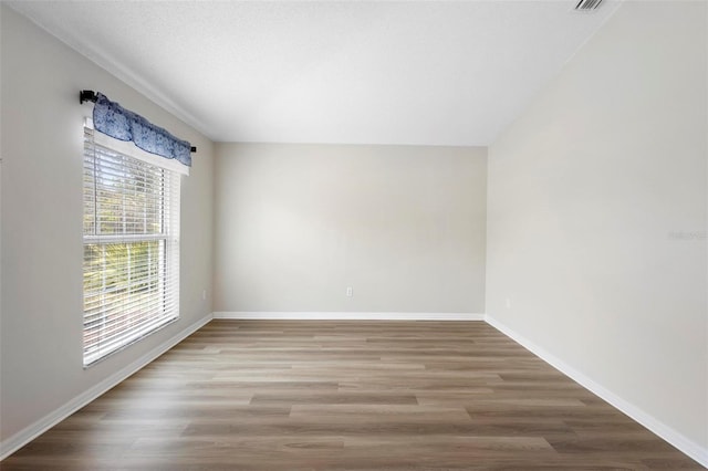 empty room featuring hardwood / wood-style flooring