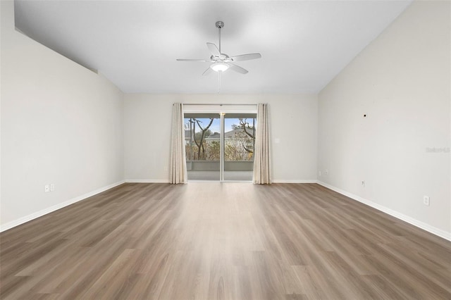 spare room with wood-type flooring and ceiling fan