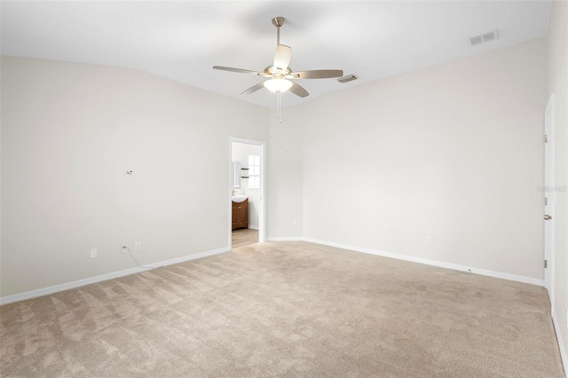 empty room with light colored carpet and ceiling fan