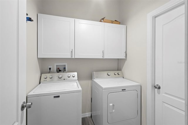 laundry area featuring cabinets and separate washer and dryer