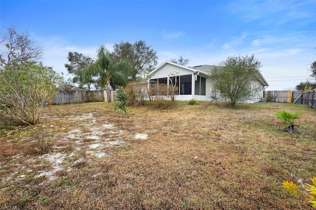 view of yard featuring a sunroom